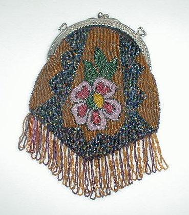 Appraisal: A Victorian bead work bag with floral design and bead