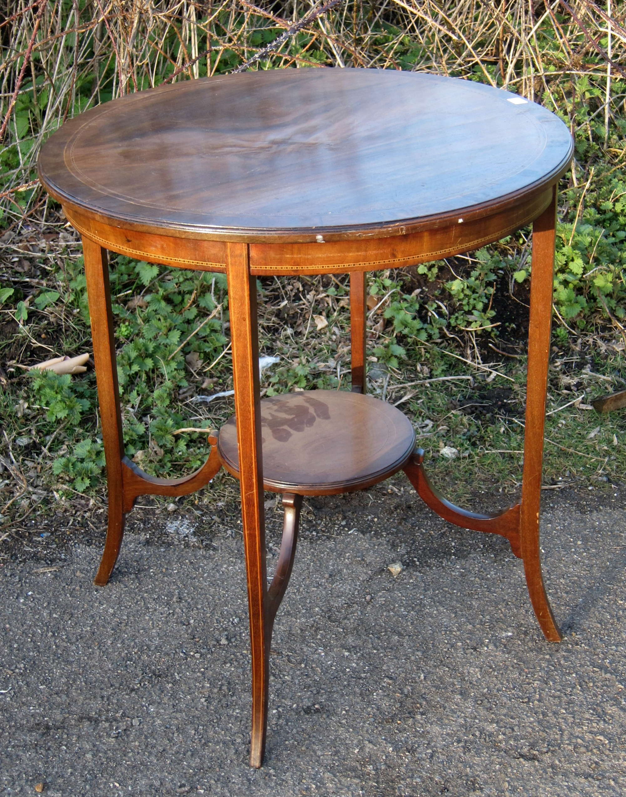 Appraisal: Mahogany circular two tier occasional table