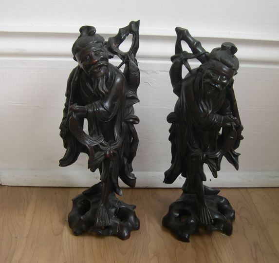 Appraisal: Pair of Kuang Hsu Elaborately Carved Hardwood Figures depicting two