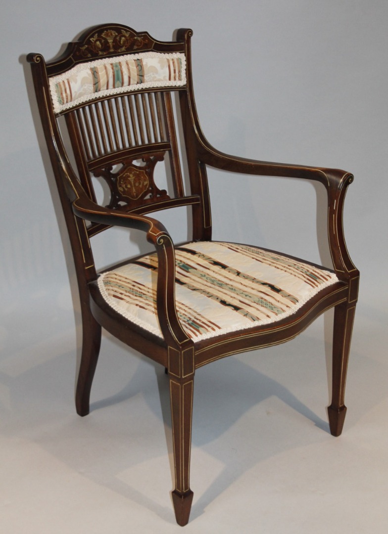 Appraisal: An Edwardian mahogany and bone inlaid elbow chair the shaped