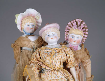 Appraisal: LOT OF STONE BISQUE DOLLS W MOLDED BONNETS finely detailed