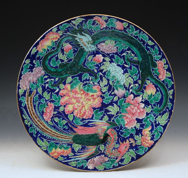 Appraisal: A CHINESE BLUE GROUND CHARGER with phoenix green dragon and