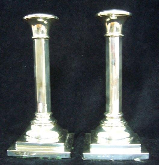 Appraisal: A pair of candlesticks of plain hexagonal column form each