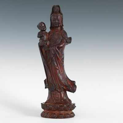 Appraisal: A Cherry Amber Quan Yin Translucent consolidated amber in the