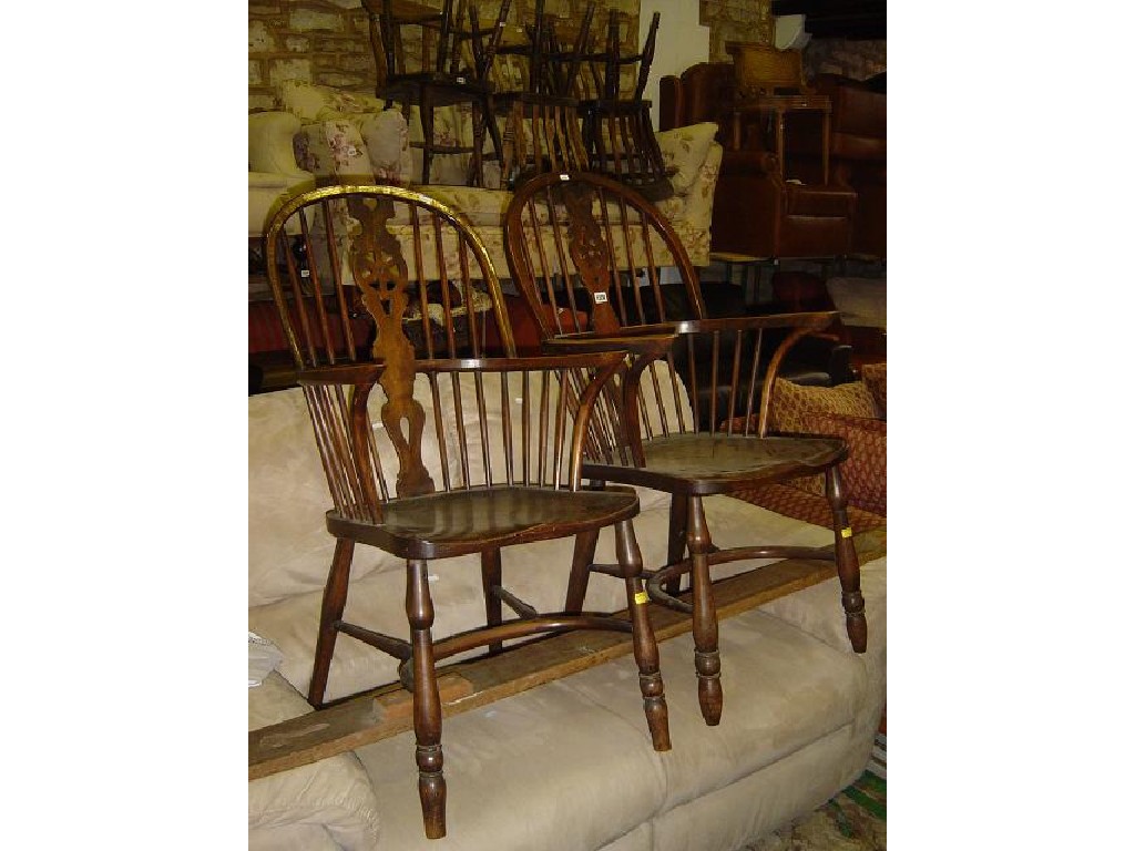 Appraisal: A near pair of Windsor wheel back kitchen elbow chairs