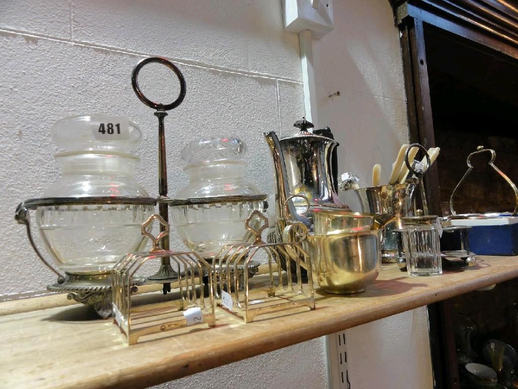 Appraisal: A silver plated stand fitted with two glass pickle jars