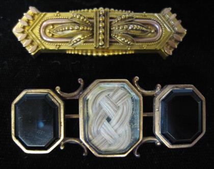 Appraisal: Two mourning style broochesBoth gold filled one brooch with onyx