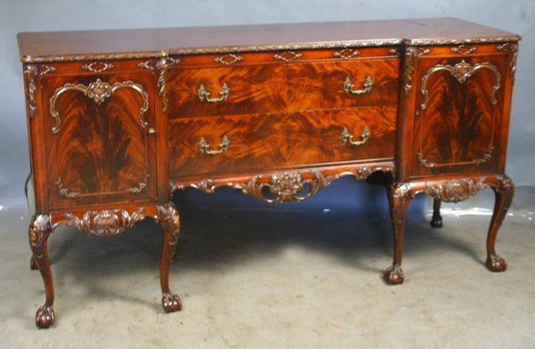 Appraisal: Circa s s Chippendale-style flame mahogany carved buffet h x