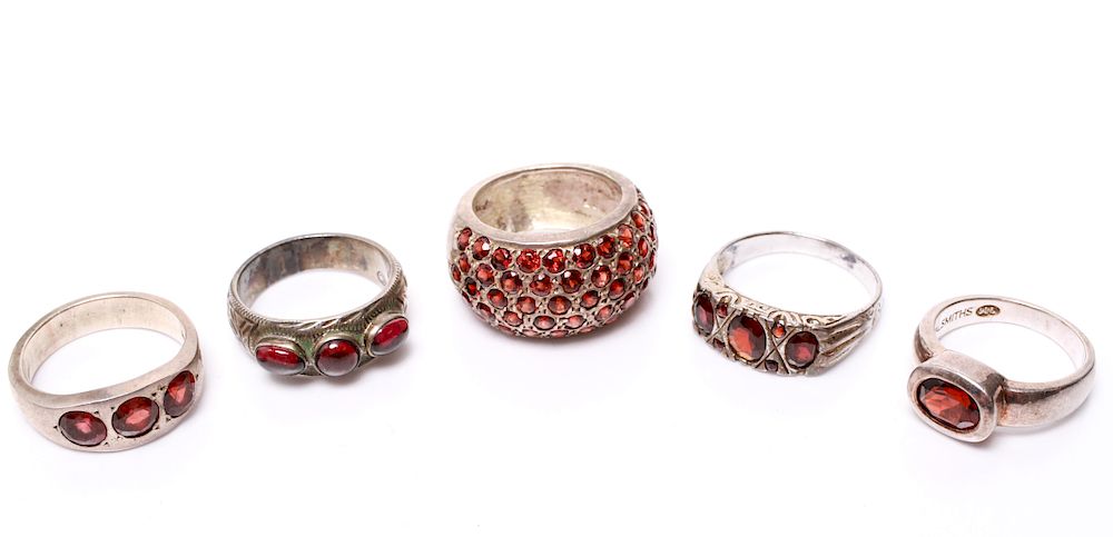 Appraisal: Sterling Silver Rings with Garnets Group of five sterling silver