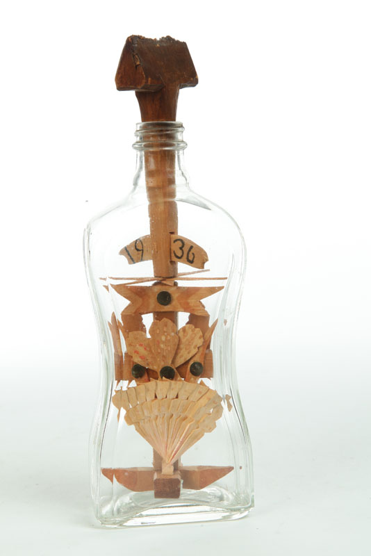 Appraisal: BOTTLE WHIMSEY American glass wood and brass tacks Waisted bottle