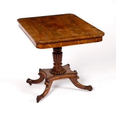 Appraisal: A Regency rosewood table with plain frieze on reeded taper