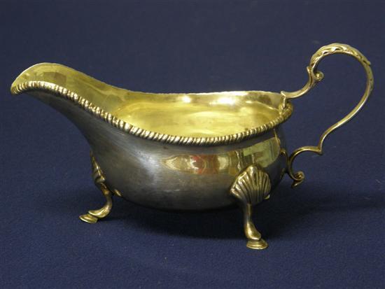 Appraisal: Late Victorian silver sauce boat with gadrooned rim foliate scrolling