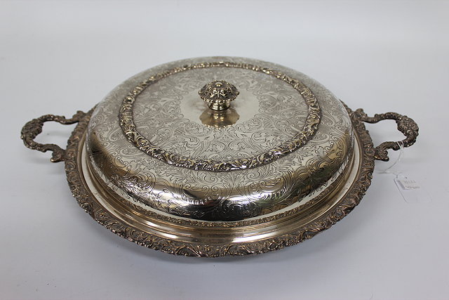 Appraisal: A SILVER PLATED CHASED AND ENGRAVED CIRCULAR CHAFING DISH with