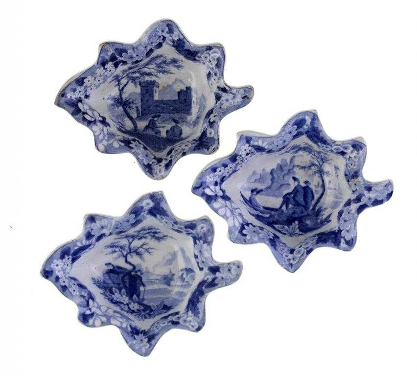 Appraisal: THREE DON POTTERY BLUE PRINTED EARTHENWARE PICKLE DISHES of vine