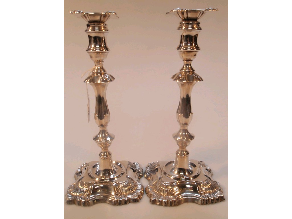 Appraisal: A pair of George V silver table candlesticks by William