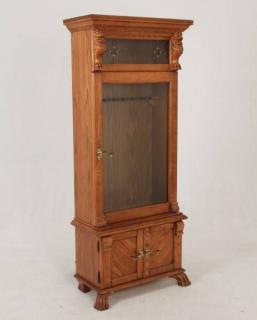 Appraisal: AMERICAN OAK GUN CABINET WITH LIONS HEAD CARVING AND LEADED