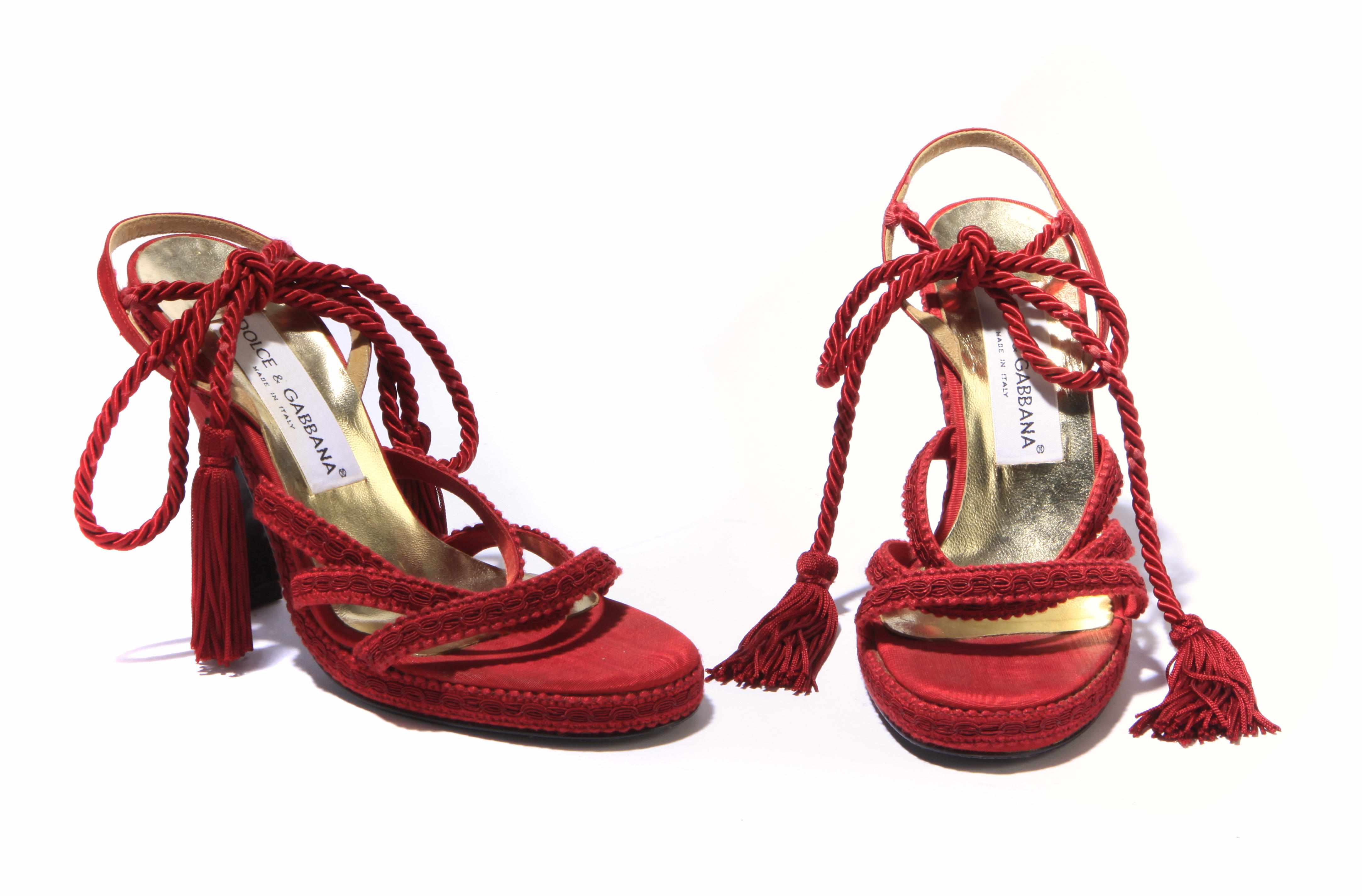 Appraisal: A pair of Dolce Gabbana red rope embellished heels size