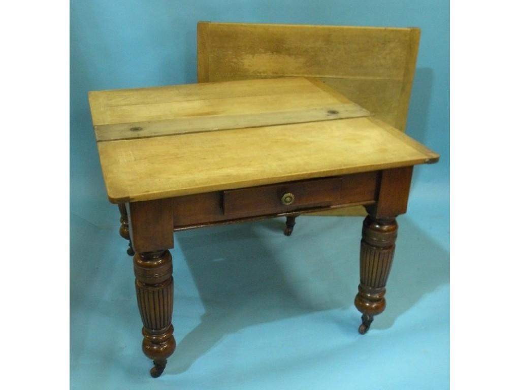 Appraisal: A walnut and pine draw leaf table on turned tapering