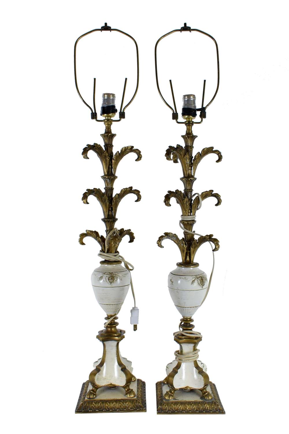 Appraisal: PAIR OF PARCEL GILT WHITE PAINTED METAL LAMPSContinental The shafts