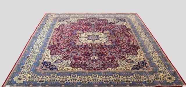 Appraisal: A FINE HAND-MADE WOOL PERSIAN CARPETRaspberry blue field cream and