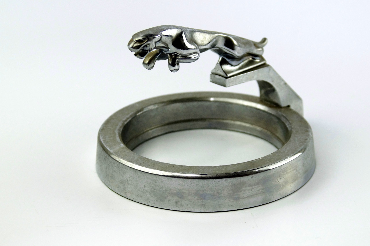 Appraisal: A Jaguar mascot upon chrome ring plinth cm diameter