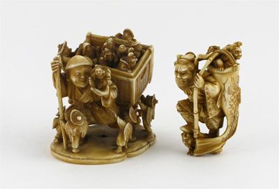 Appraisal: Two Japanese ivory carvings one of a figure carrying a