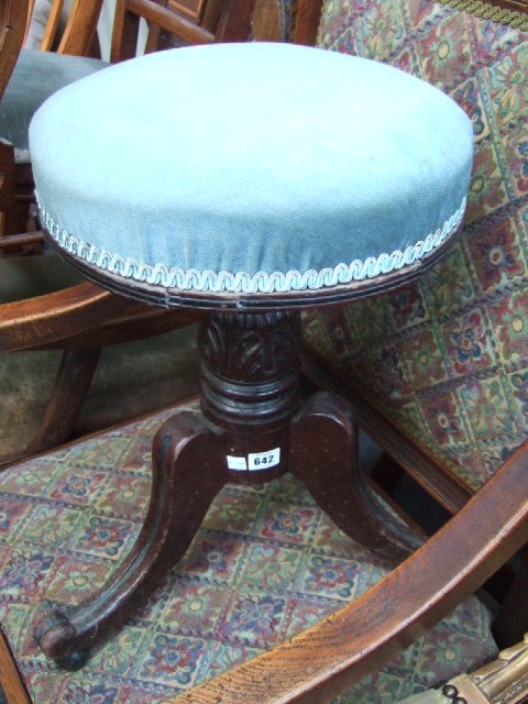 Appraisal: A Victorian mahogany piano stool the height adjustable circular top