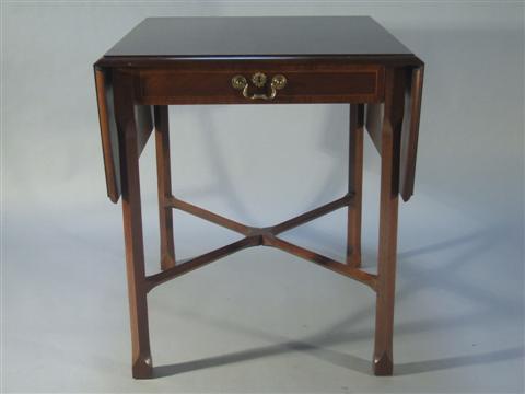 Appraisal: BAKER CHIPPENDALE CHERRY PEMBROKE TABLE The rectangular top with drop