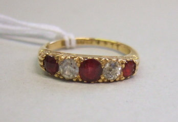 Appraisal: An ct gold ruby and diamond set five stone ring