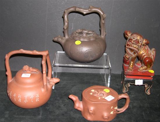 Appraisal: Three clay teapots with twig form handles and spouts one