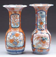 Appraisal: PAIR OF LARGE IMARI POLYCHROMED VASES The paneled sides having