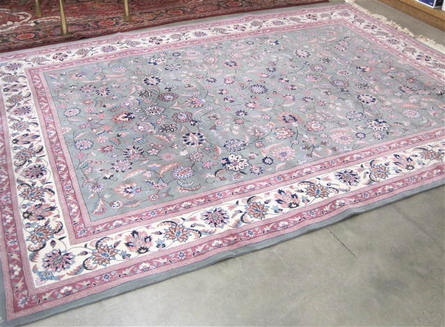 Appraisal: HAND KNOTTED ORIENTAL CARPET Sino-Persian floral Isfahan design on celadon