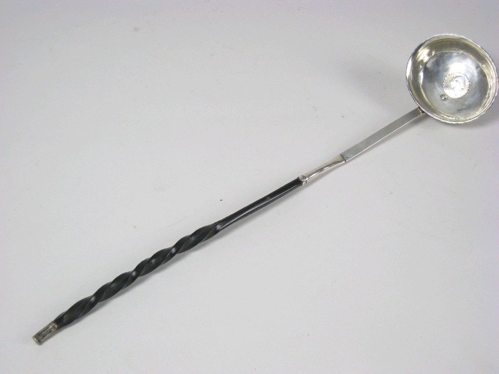 Appraisal: A Georgian Punch Ladle with coin inset bowl and spiral