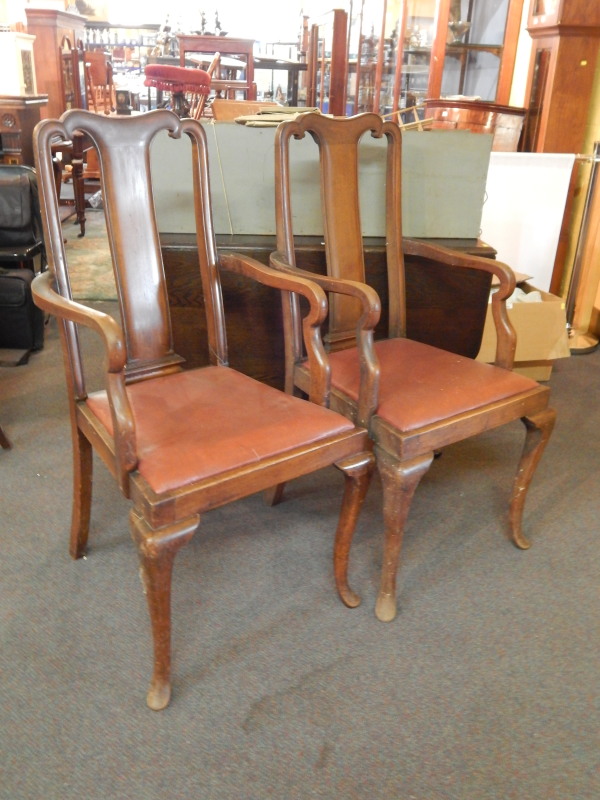 Appraisal: A pair of Edwardian mahogany open armchairs each with a