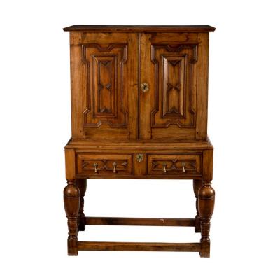 Appraisal: A walnut cabinet of Charles II style the panel doors