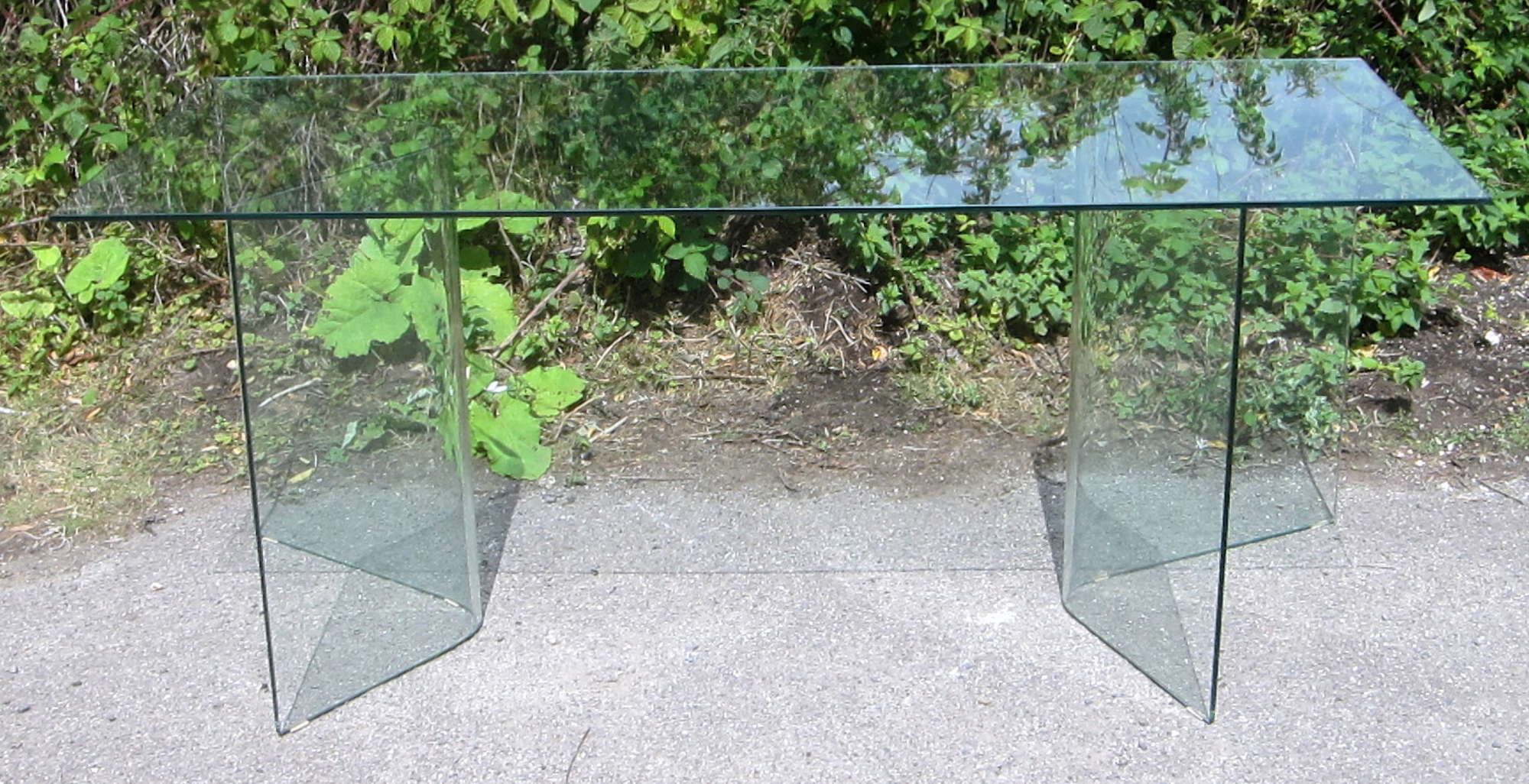 Appraisal: Glass dining table rectangular glass top on two shaped pedestals