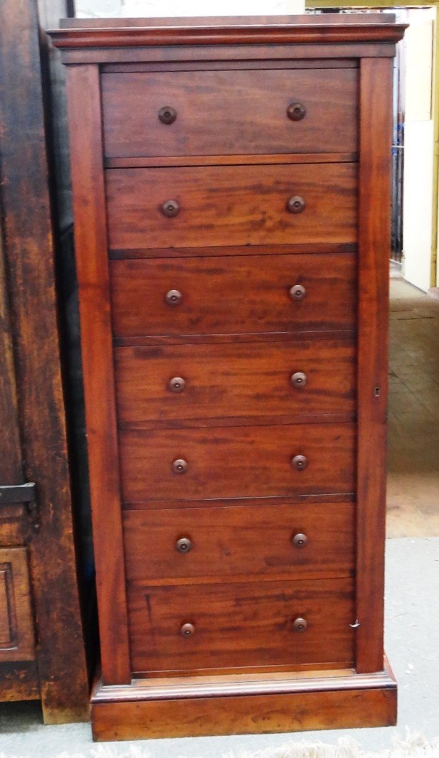 Appraisal: A th century mahogany Wellington chest the seven drawers enclosed