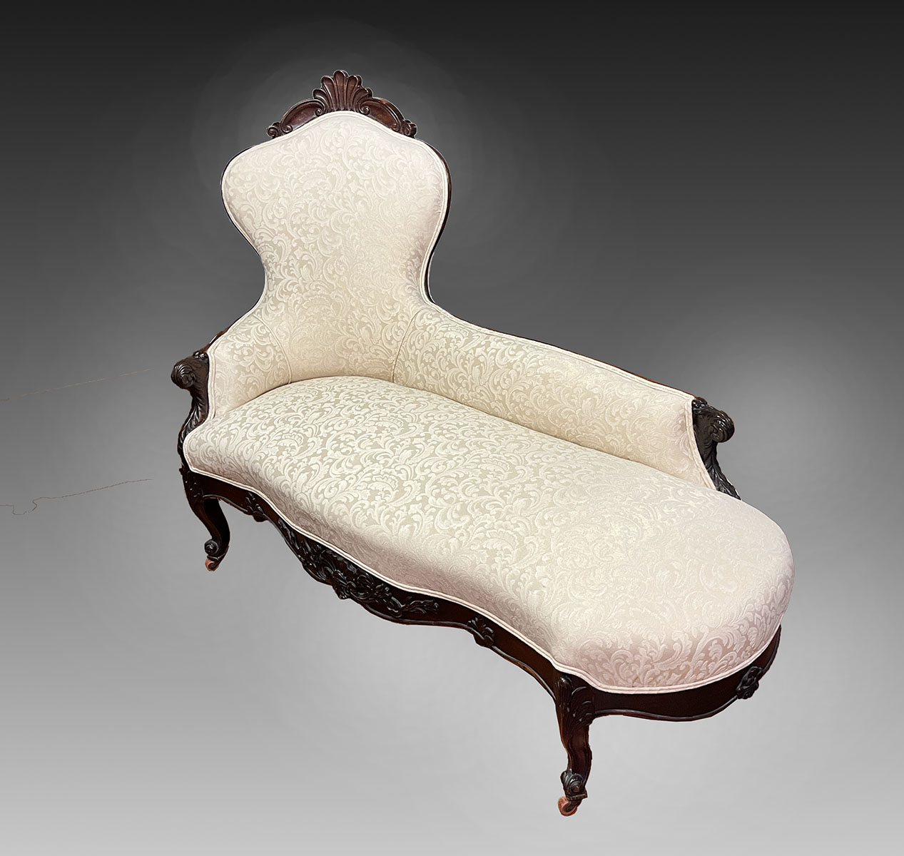 Appraisal: VICTORIAN RECAMIER Off-white upholstery with a scrolling foliate pattern Carved