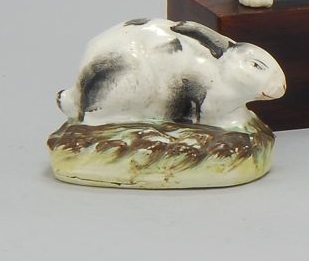 Appraisal: STAFFORDSHIRE FIGURE OF A RABBIT Circa With black and white