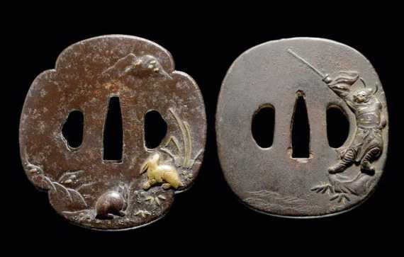 Appraisal: TWO IRON TSUBA ONE OF RABBITS AND ONE OF A