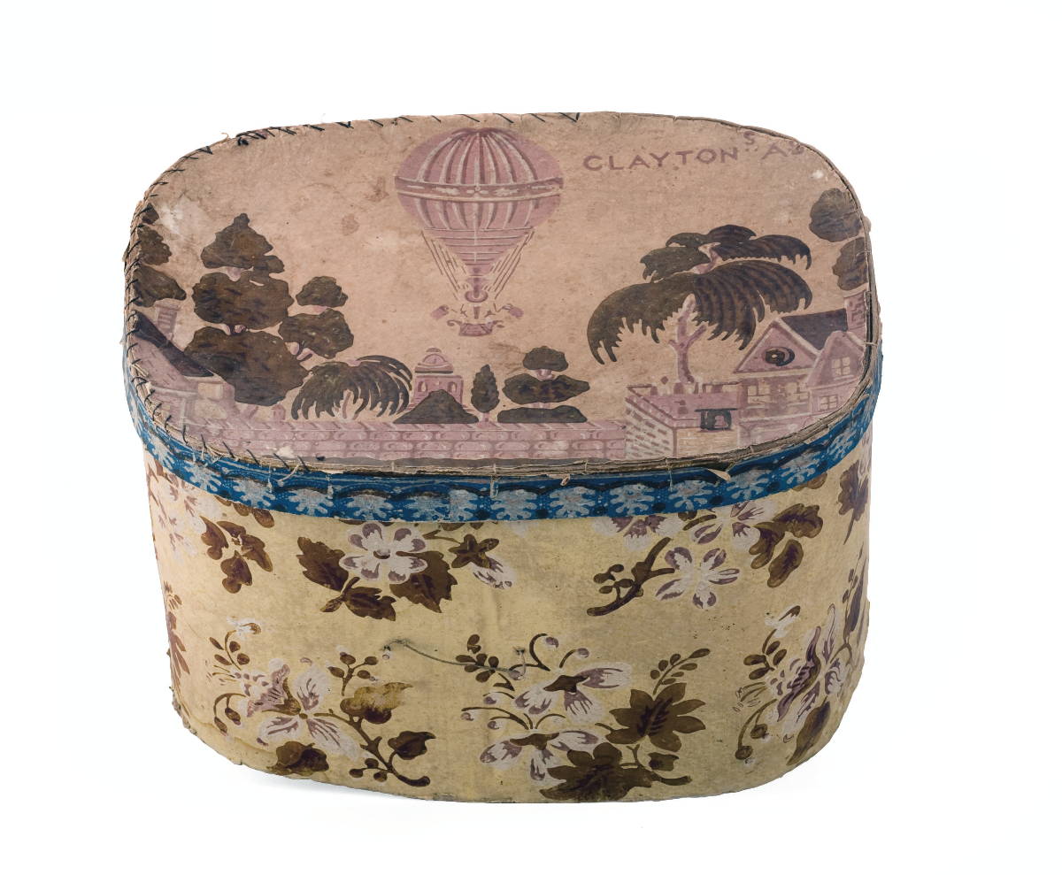 Appraisal: YELLOW FLORAL DECORATED HAT BOX The top with a hot