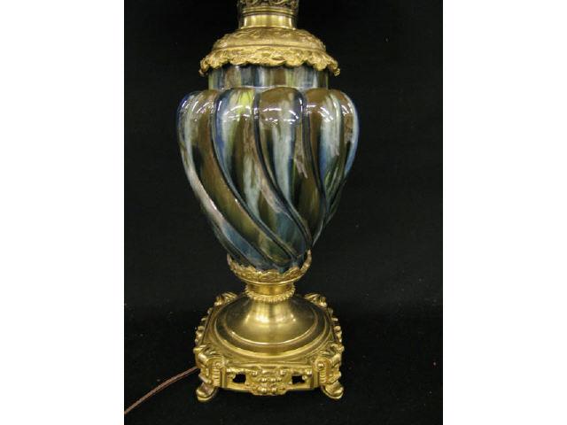 Appraisal: French Victorian Majolica Pottery Lamp swirling body bronzed trim