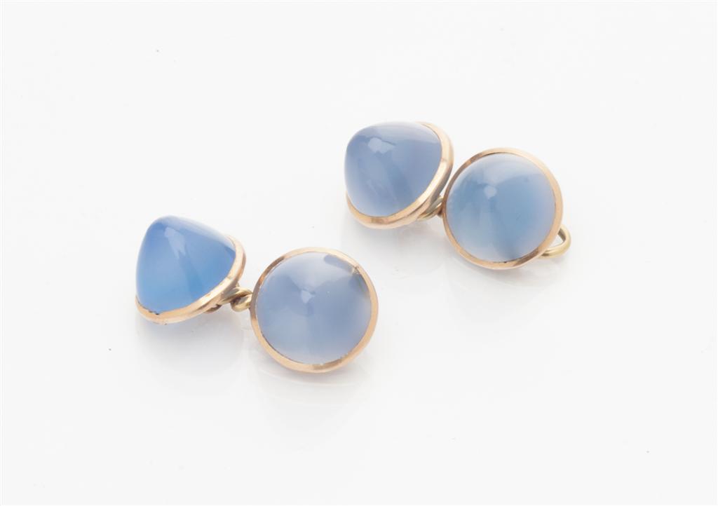 Appraisal: A pair of cabochon chalcedony cufflinks each terminal composed of