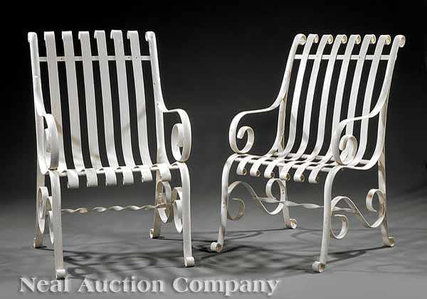 Appraisal: A Pair of Vintage Wrought Iron Garden Chairs having scrolled