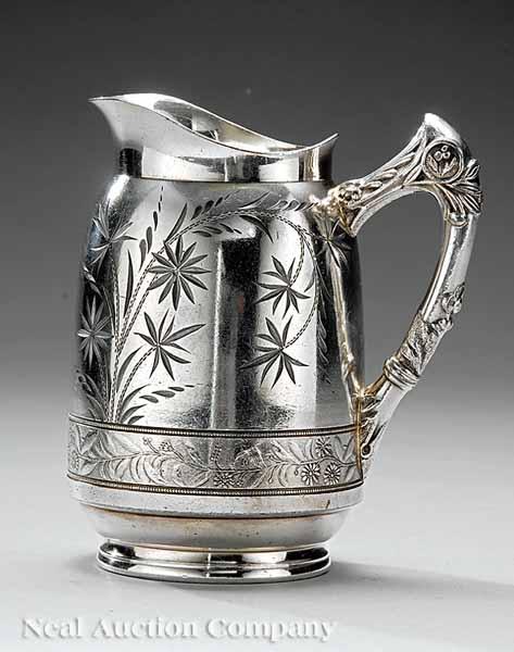 Appraisal: An American Aesthetic Quadrupleplate Cream Pitcher by West Silver Co