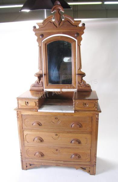 Appraisal: An antique walnut Renaissance Revival dresser with marble insert in