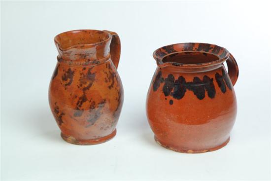 Appraisal: TWO REDWARE PITCHERS American mid th century Bulbous with applied