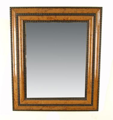 Appraisal: A rectangular faux tortoiseshell ripple moulded wall mirror with bevelled