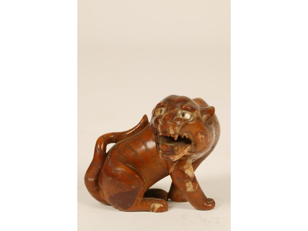 Appraisal: A JAPANESE MARBLE TIGER the snarling beast with carved stripes