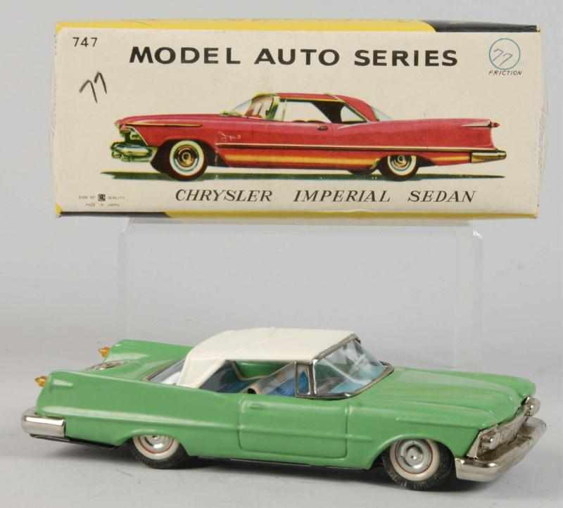 Appraisal: Tin Litho Chrysler Imperial Sedan Friction Toy Description Japanese Working